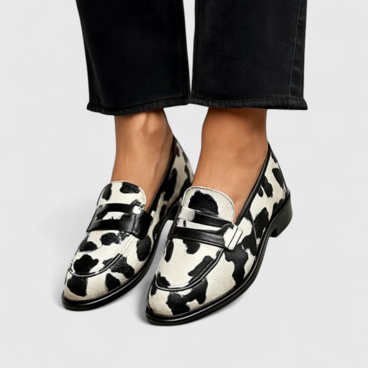 Lilah cow print buckle loafers in Black and White