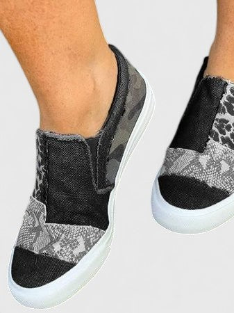 Zora animal print slip-on sneakers in Black