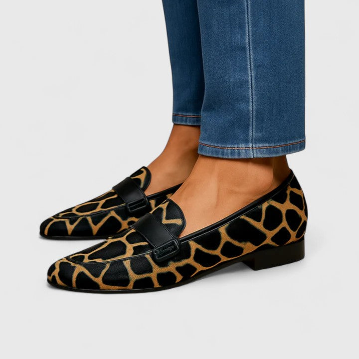 Emmeline giraffe print pointed loafers in Black and Gold